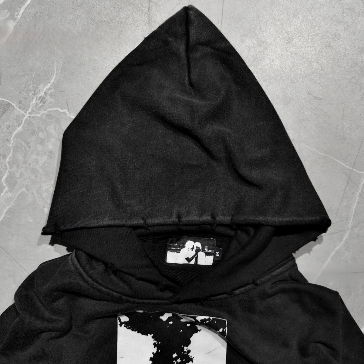 Missing Faces Hoodie hood and neck label detail