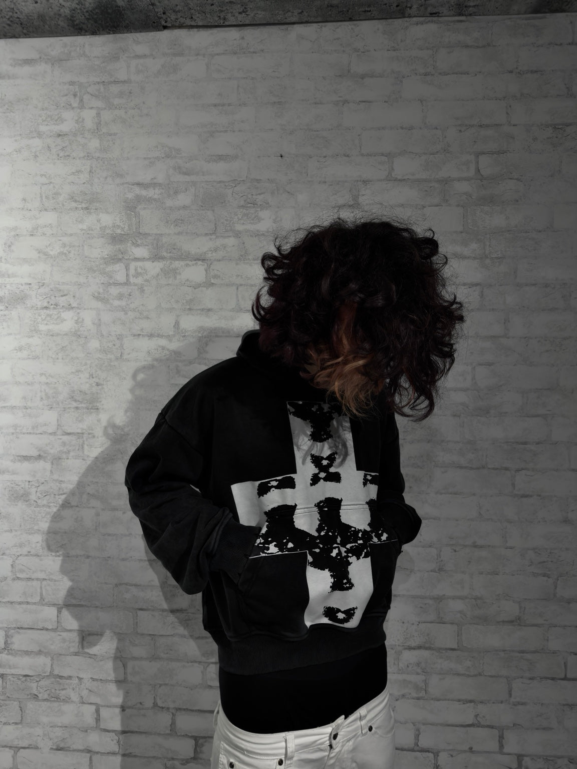Missing Faces Hoodie on model with hands in pocket